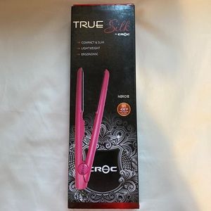 The  Croc Nero Titanium Flat Iron has floating plates and a rounded barrel. NIB